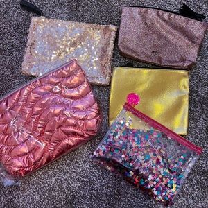 5 cosmetic makeup bags: Sequin, glitter, confetti, gold, pink. PUR, IPSY, ULTA.